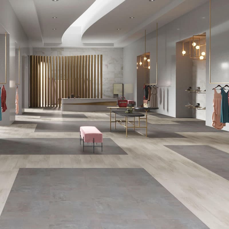 Pavimento Stone effetto pietra targato Looselay Design Flooring installato in un salone in un negozio di abbigliamento